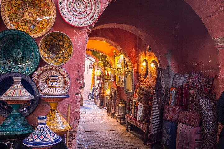 Colorful pottery displayed inside a traditional Moroccan market